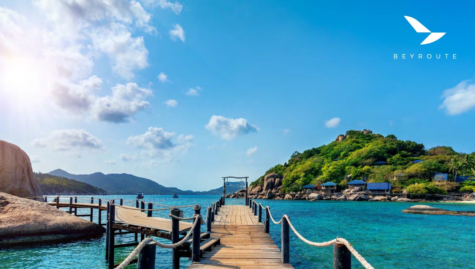 Beyroute logo over a tropical waterfront and wooden pier